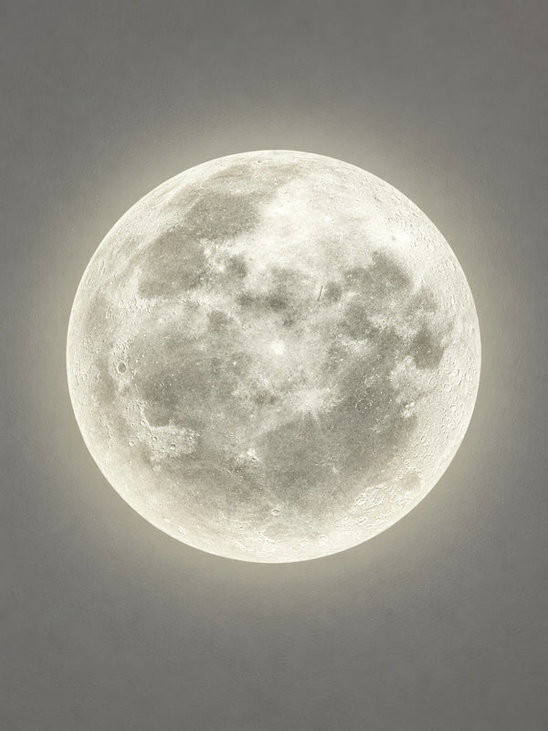 Close-up of the 3D moon wall lamp showing crater detail in warm white light