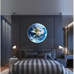 Earth LED wall lamp centred above the bed in a grey bedroom
