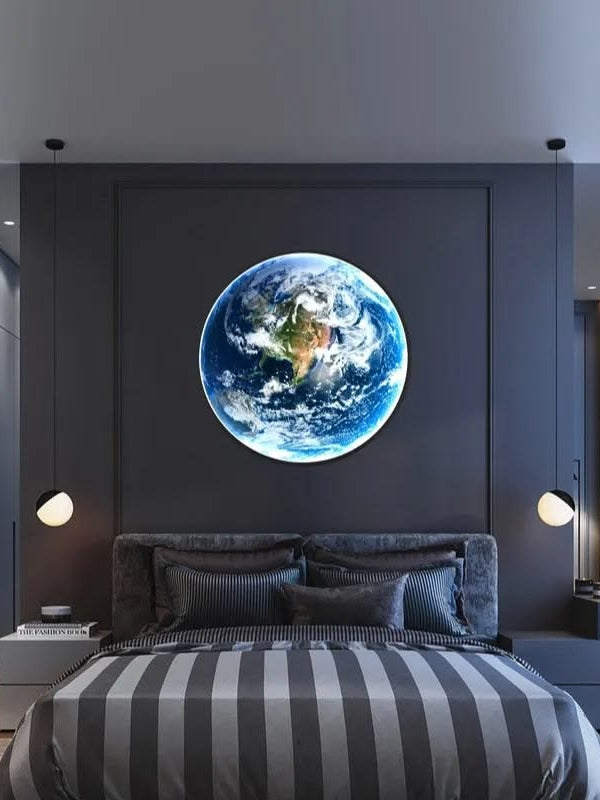 Earth LED wall lamp centred above the bed in a grey bedroom