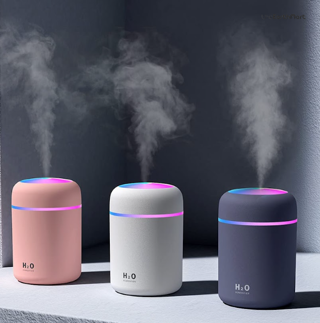 H2O mini humidifiers in pink, white and navy releasing mist