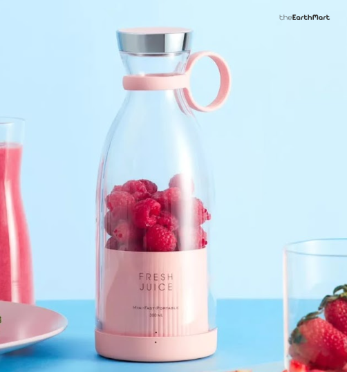 Pink portable bottle blender with berries
