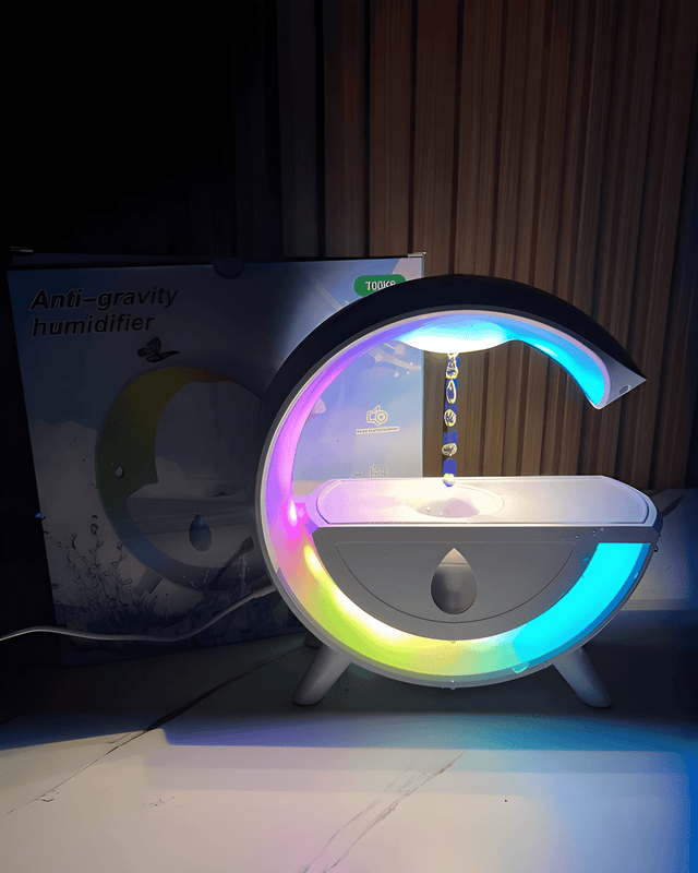 Humidifier speaker glowing in a dark room